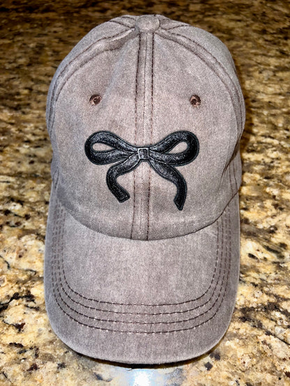 Brown cap with black bow